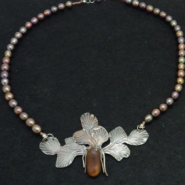 Example of precious metal clay and pearl necklace.