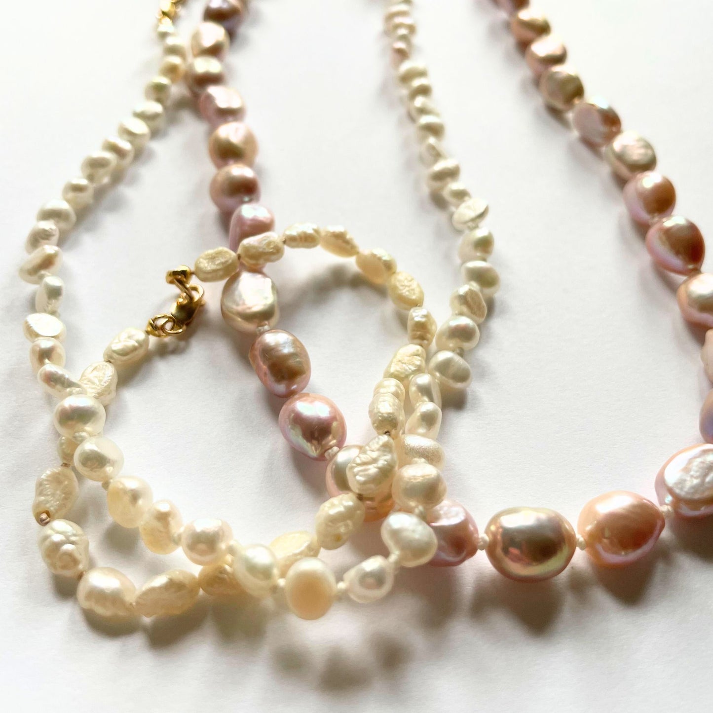 Examples of knotted pearl strands
