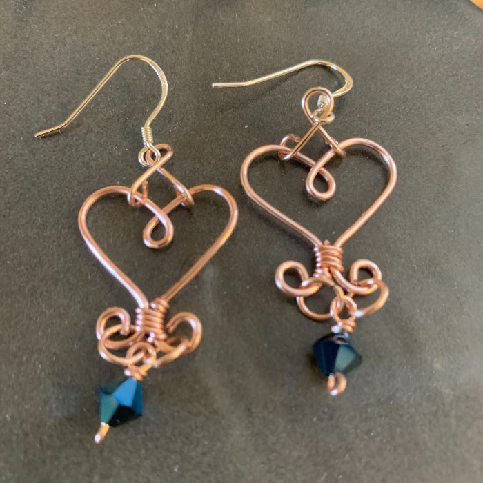 Closeup of heart wire earrings