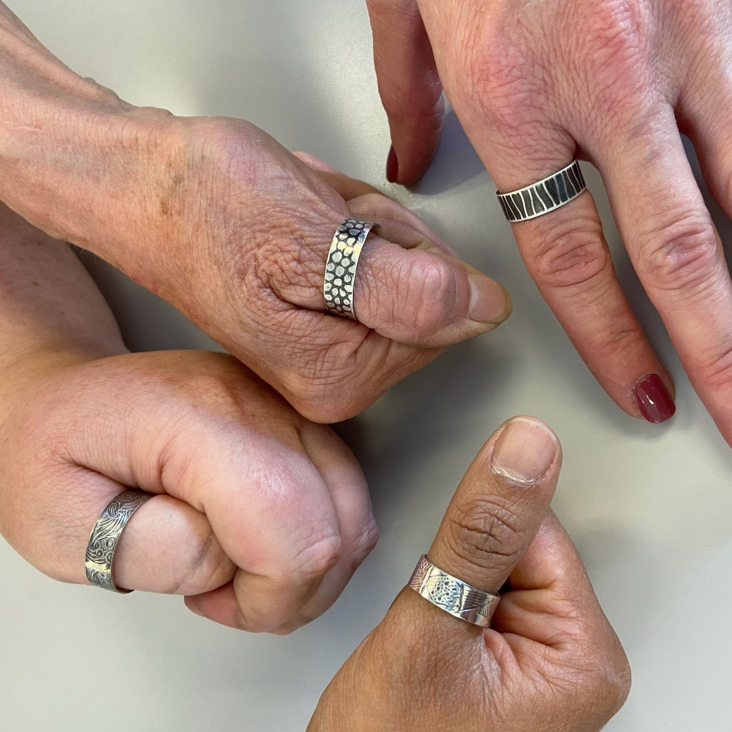 Students wearing the silver rings they made